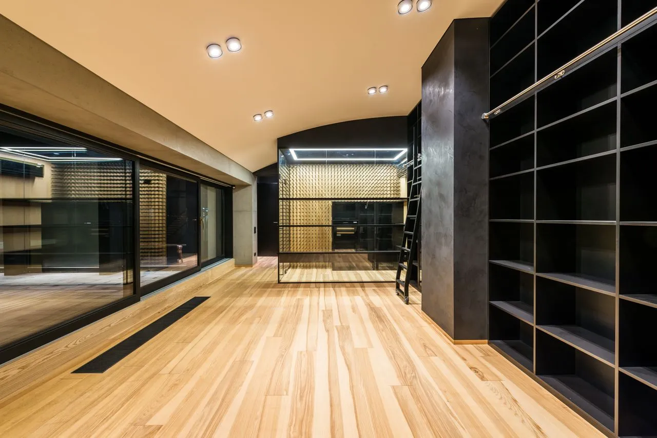 Definitive view of the apartment's custom joinery and gallery corridor