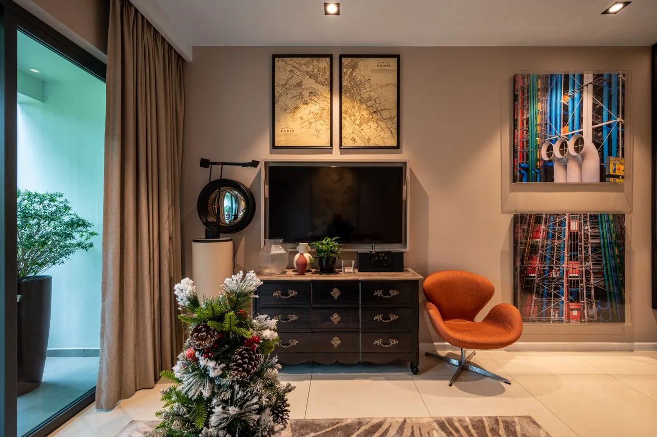 Artwork, cabinet and orange chair in the living room