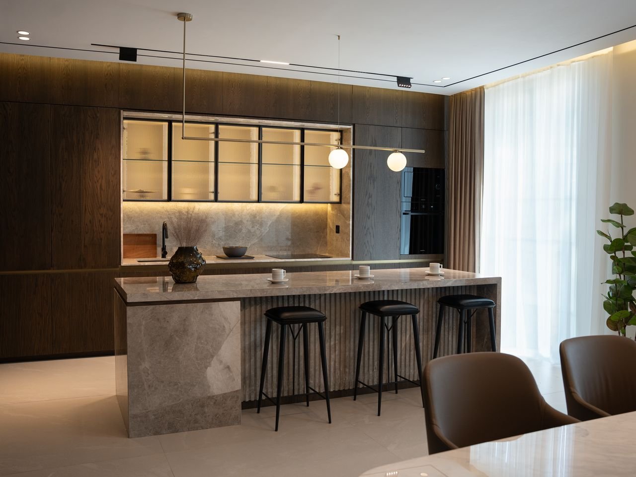 Timber kitchen and stone breakfast island in soft daylight
