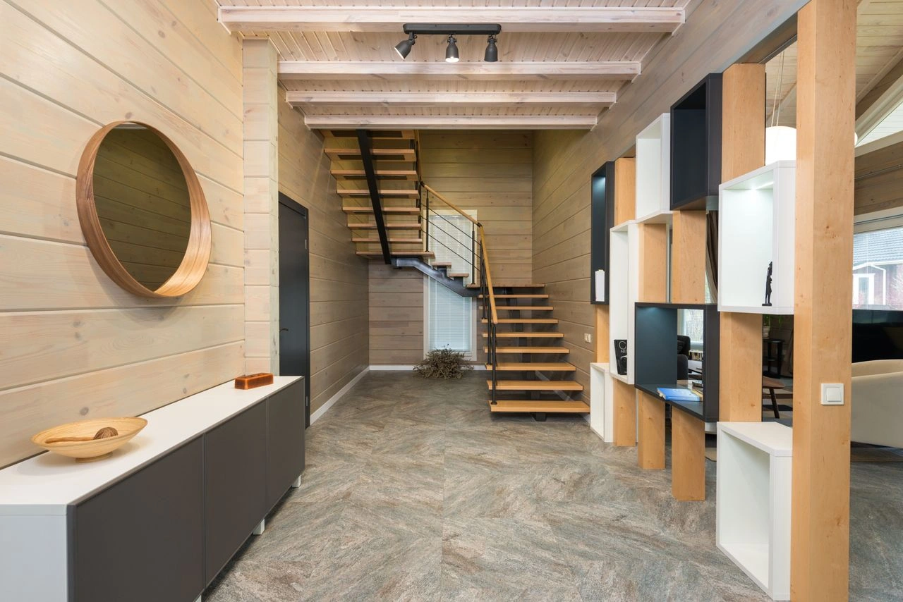 Timber-lined hall with open stair and integrated shelving