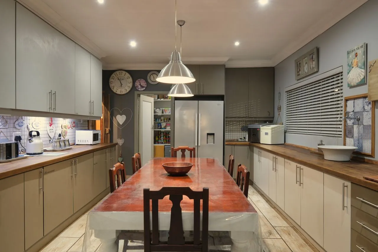 Long family kitchen with central work table