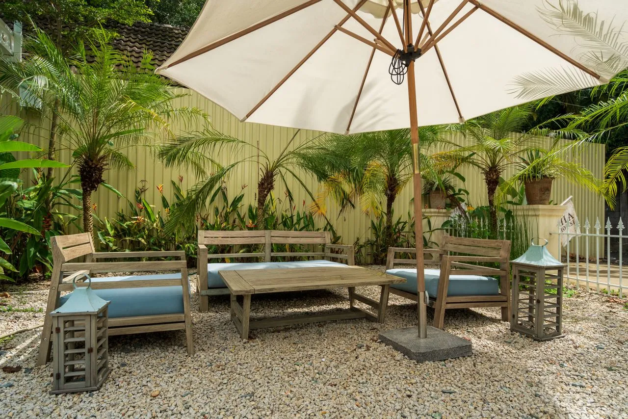 Relaxed outdoor seating beneath a garden umbrella